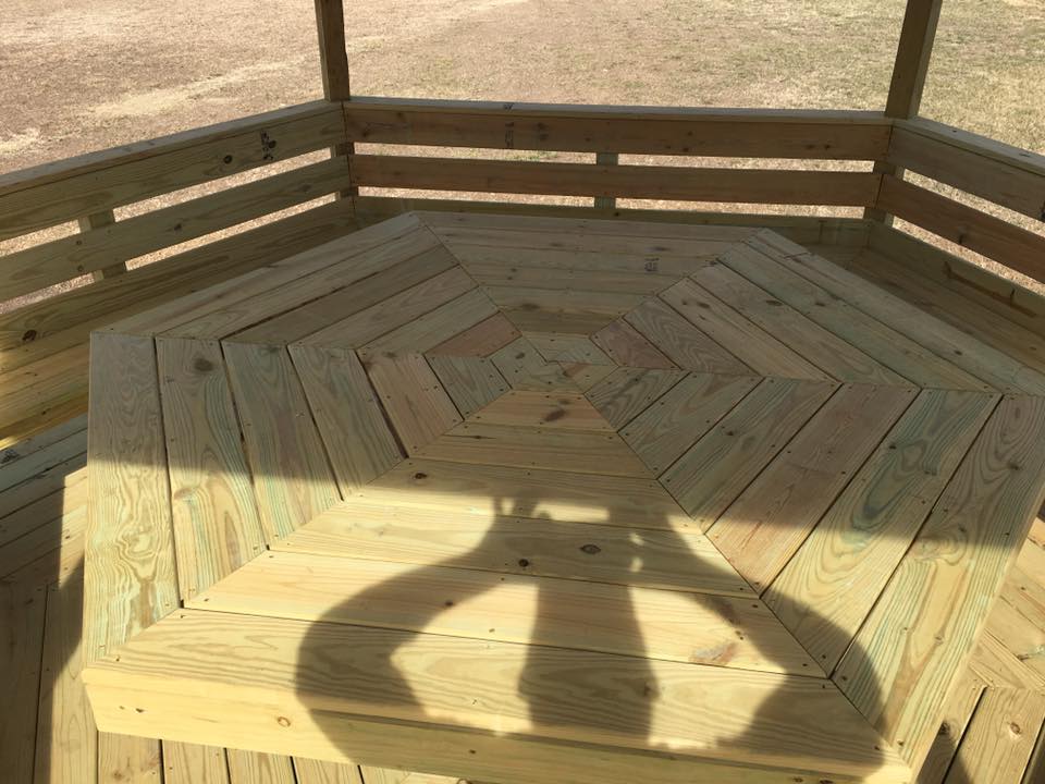 Custom herringbone deck pattern with built-in corner seating